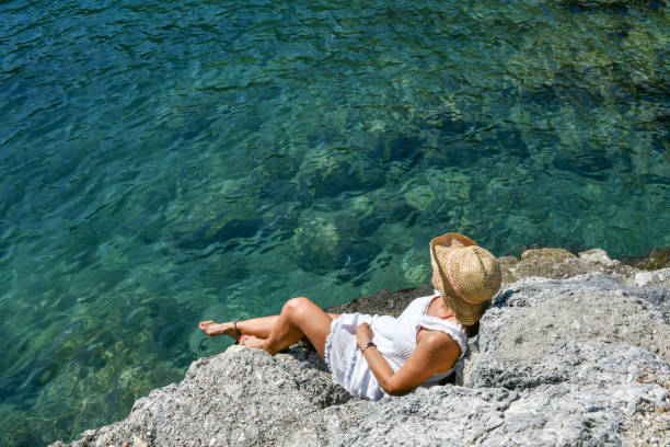 Woman looking at the sea.