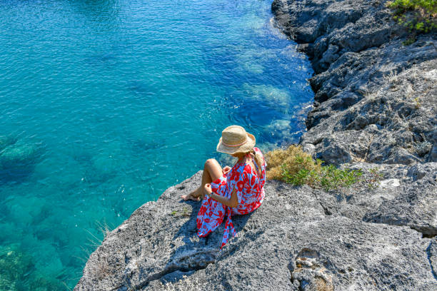istock Woman looking at the sea. 1268450528