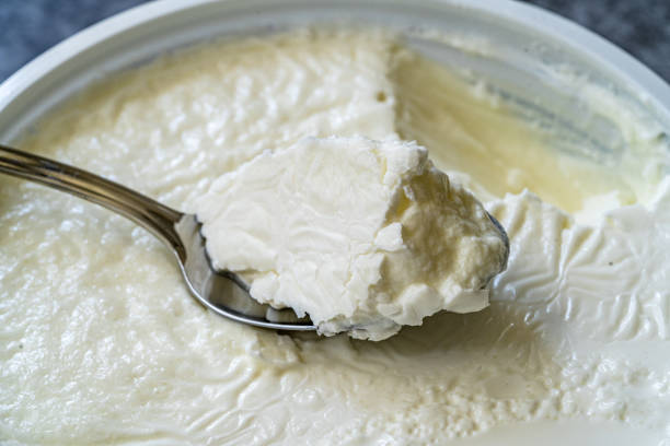 istock Instant Sheep Yogurt / Yoghurt with Spoon in Plastic Cup. 1268450958