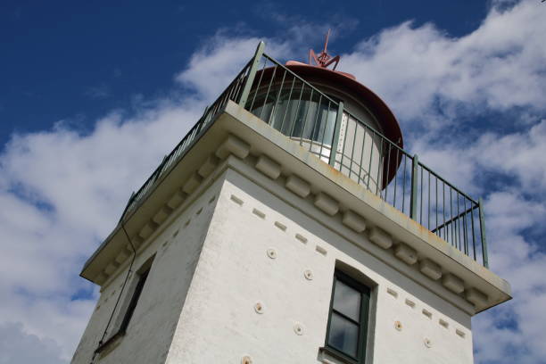 istock Spodsbjerg Fyr (lighthouse) blue sky and clouds 1268453263