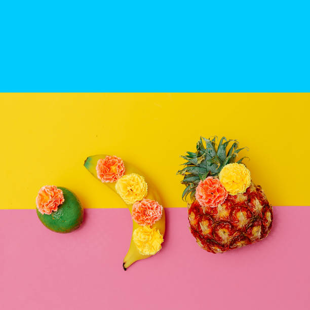 Tropical fruits in flowers. Minimal flat lay fruits art