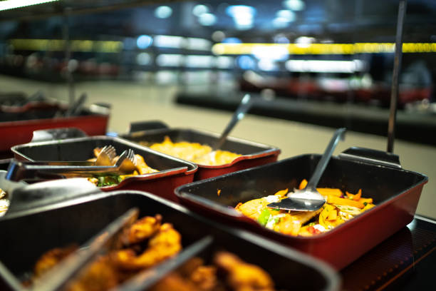 Uneaten dishes sit on a wooden table in cafe.