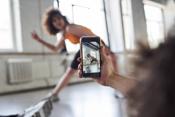 istock Smiling pretty lady is showing new dance in studio 1268459897