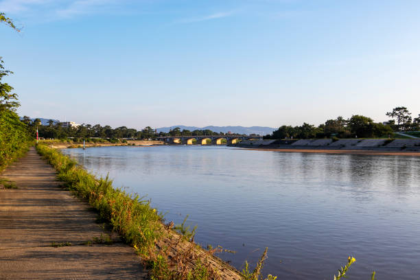 istock Walk along the quiet riverbank in the morning 1268462910