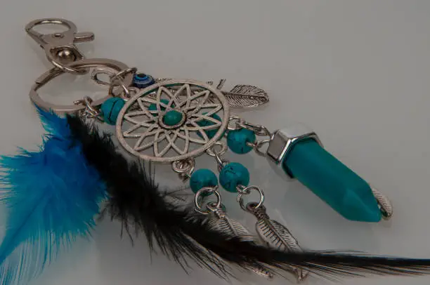 Photo of a beautiful keychain with feathers and stones