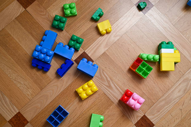 istock scattered colored children's constructor on the wooden floor 1268463268