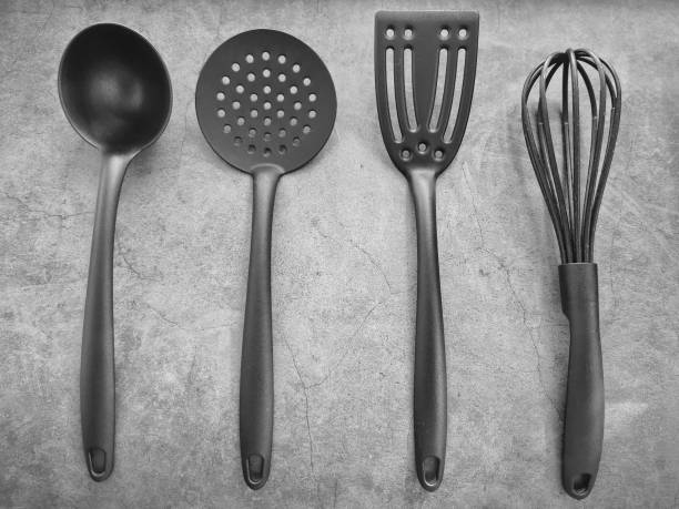 istock Set of black modern kitchen utensils on dark background. Menu concept. Top view. 1268463343
