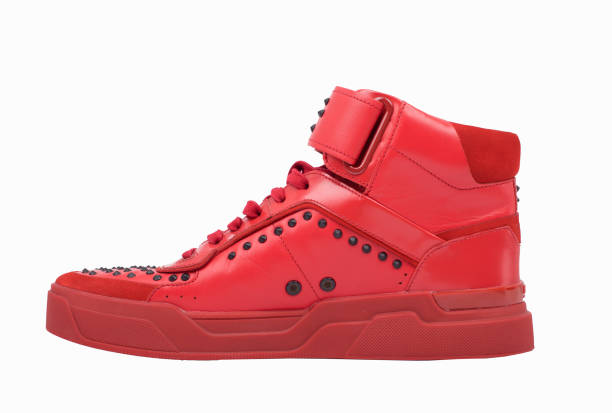 istock Stylish red shoes isolated on white background. Unique boots 1268465076