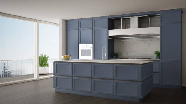 istock Classic blue kitchen in modern open space with parquet floor and big panoramic window with balcony on sea landscape, island and accessories, minimalist contemporary interior design 1268465998