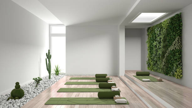 istock Empty yoga studio interior design, open space with mats, pillows and accessories, parquet, vertical garden and succulent plants with pebbles, ready for yoga practice, meditation room 1268466536