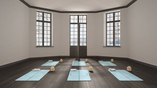 istock Empty yoga studio interior design, minimal classic space, parquet floor, walls with stucco, mats and accessories, ready for yoga practice, meditation, panoramic window, winter view 1268466547