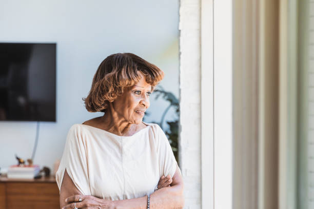 istock Self isolating due to coronavirus, senior woman is sad 1268467571