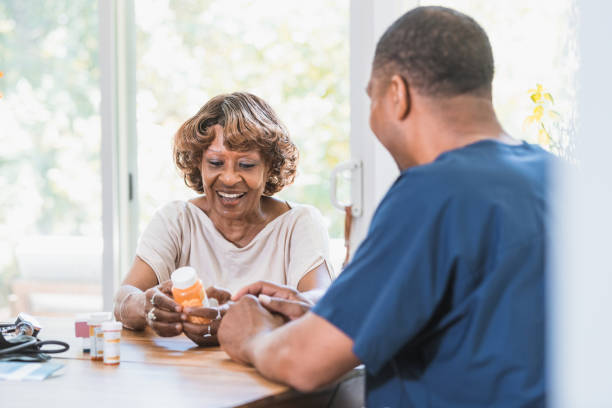 istock Senior woman discusses medication with nurse 1268467618