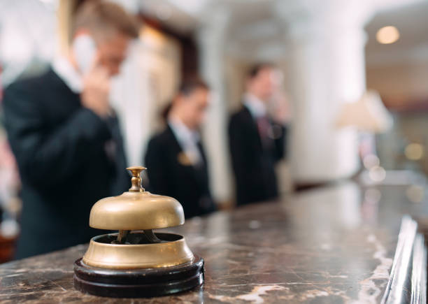 Hotel service bell Concept hotel, travel, room,Modern luxury hotel reception counter desk on background. Hotel service bell Concept hotel, travel, room,Modern luxury hotel reception counter desk on background bellhop stock pictures, royalty-free photos & images
