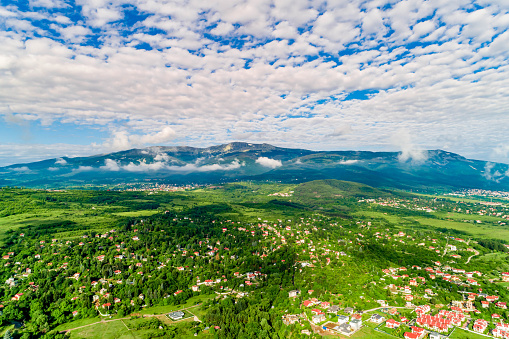 Aerial view of Lozen and Lozen mountain in Sofia, Bulgaria during spring time. The scene is situated in Sofia city capital of Bulgaria (Eastern Europe). The picture is taken with DJI Phantom 4 Pro drone.