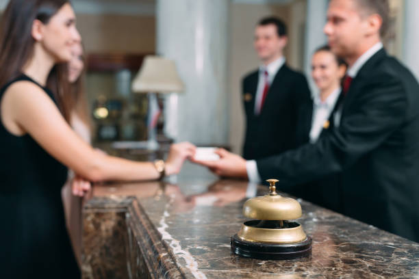 Picture of guests getting key card in hotel. stock photo