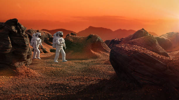 istock astronauts on Mars, space travelers exploring the red landscape on the red world 1268472842