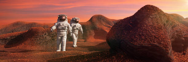 istock astronauts on Mars, space travelers exploring the red landscape on the red world 1268472876