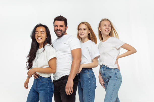 istock Group of adorable multiethnic friends having fun isolated over white studio background 1268474775