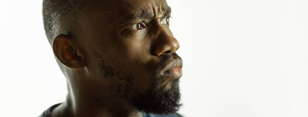 istock African-american young man's close up shot on studio background, flyer 1268477608
