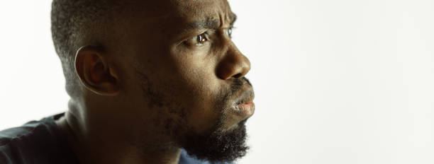 istock African-american young man's close up shot on studio background, flyer 1268477613
