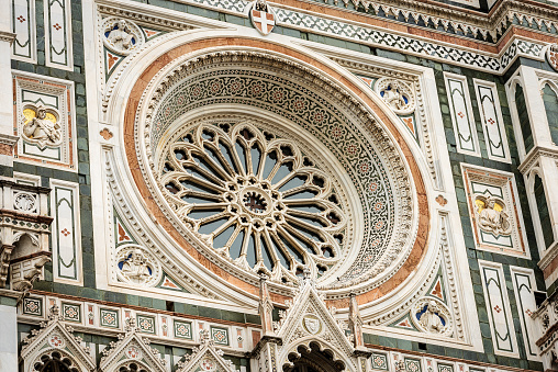 Florence Cathedral, Duomo of Santa Maria del Fiore, closeup of the Main Facade with the Rose Window. UNESCO world heritage site, Tuscany, Italy, Europe