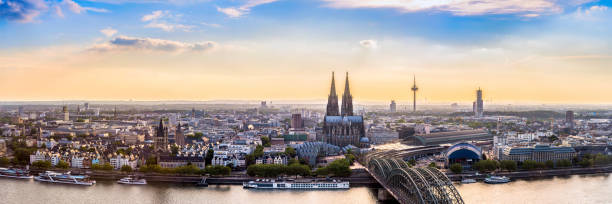 Panorama of Cologne skyline Panorama of Cologne with Cologne Cathedral and the Rhine on a beautiful summer evening koln germany stock pictures, royalty-free photos & images