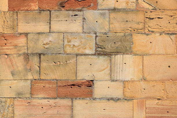 istock Old brick wall, old texture of red stone blocks closeup 1268484372