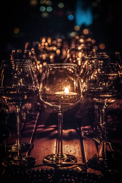 istock Evening Dinner Wine Glasses With Kerosene Lamp On Table In Okavango Delta In Bostwana 1268485196