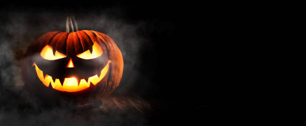 Halloween pumpkin head jack-o-lantern Halloween pumpkin head jack-o-lantern on dark background halloween pumpkin scary stock pictures, royalty-free photos & images