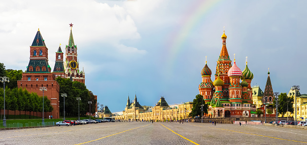 Rainbow over Red Square in Moscow after a thunderstorm, panoramic view. Moscow Kremlin, St. Basil's Cathedral, Spasskaya Tower