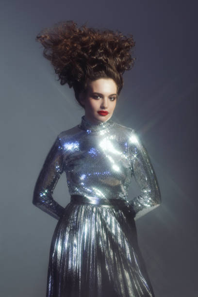 istock Beautiful woman in sparkly silver outfit 1268490903