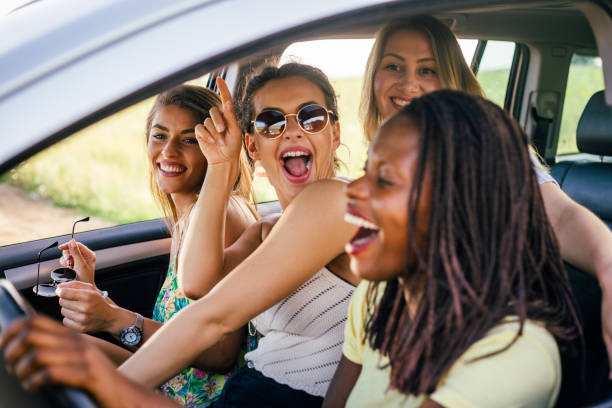 istock Girls having fun on road trip 1268493185