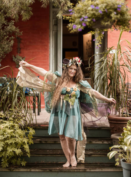 istock Woman dressed as fairy on front stoop 1268493329