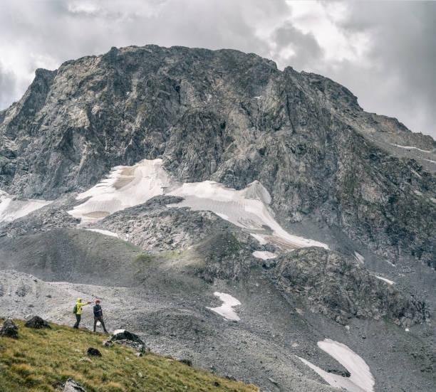 istock Men hiking at mountain background 1268495266