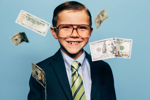 istock Young Boy Small Business Owner with Money 1268496661
