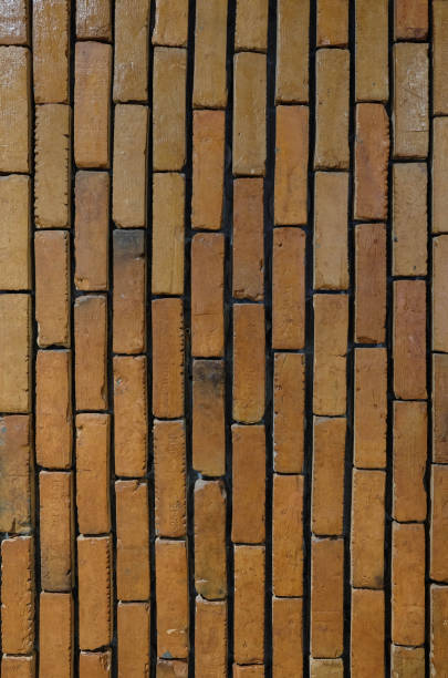 istock Old weathered red brick wall.   Grunge red vintage background 1268499314