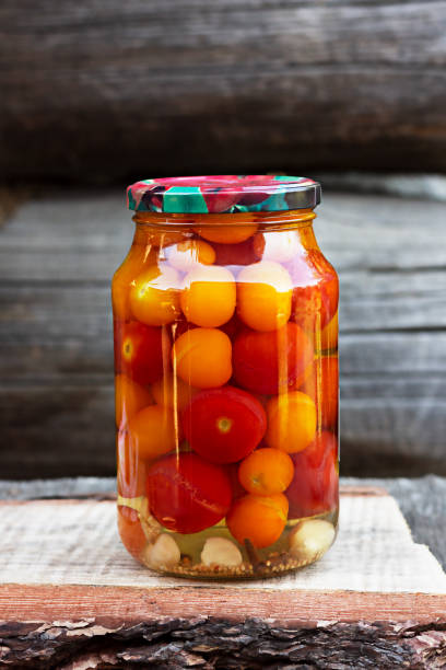 istock Tomatoes in a glass jar, homemade pickles 1268500918