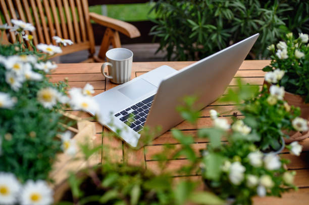 Top view of laptop on table on balcony in summer, outdoors office concept. Top view of laptop and coffee on table on balcony in summer, outdoors office concept. terraced field stock pictures, royalty-free photos & images