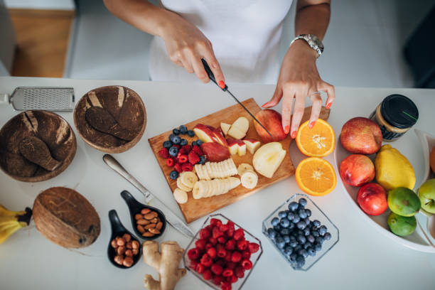 istock Woman preparing healthy breakfast in kitchen 1268503284