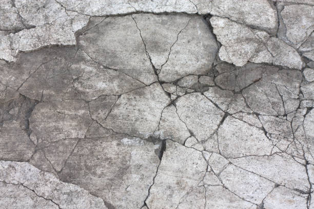 istock Black and white cracked concrete texture, closeup background 1268504158