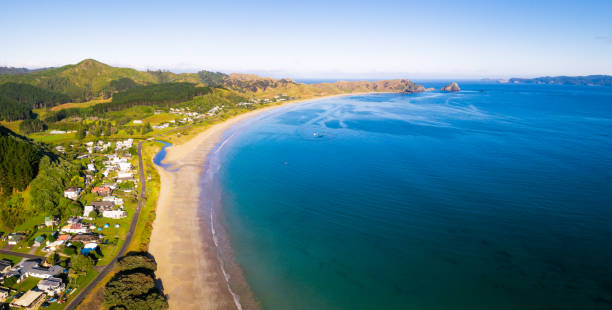 Opito Bay on New Zealand's Coromandel Peninsula An aerial view along the idyllic coastline of Opito Bay, part of the Coromandel Peninsula on New Zealand's North Island. coromandel peninsula stock pictures, royalty-free photos & images