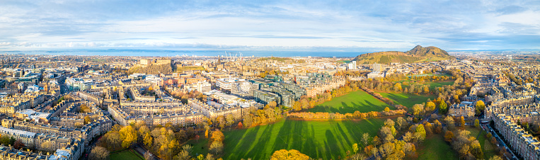 An aerial view over the central part of Scotland's capital city looking northwards, with the Fife coast visible on the horizon.