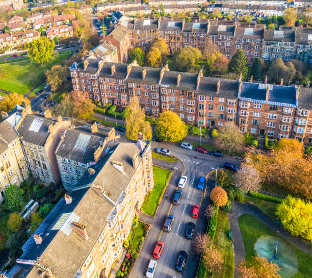 Residential Glasgow streets from the air An aerial view of residential streets in Broomhill, in the West End of Glasgow, with a public play park, tenement blocks and houses. glasgow scotland stock pictures, royalty-free photos & images