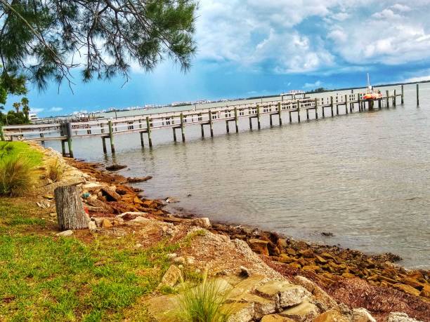 Sunny afternoon view over the water from Dunedin, Florida looking to the beach coast of Clearwater beach, FL.