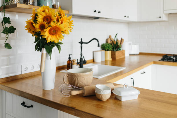istock Dishes and utensils on kitchen table, ready to cook. 1268509729