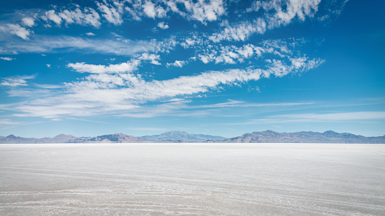 Salt Flats Desert Panorama under blue sunny summer skyscape close to Bonneville, Salt Lake City, Utah, USA.