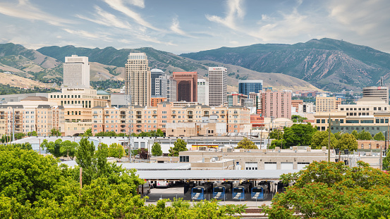 Skyline Panorama of Salt Lake City Cityscape in front of Wasatch Mountain Range on a sunny summer day. Salt Lake City, Utah, USA.