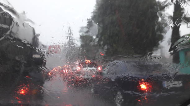 istock Rain storm and  cars in traffic 1268513725