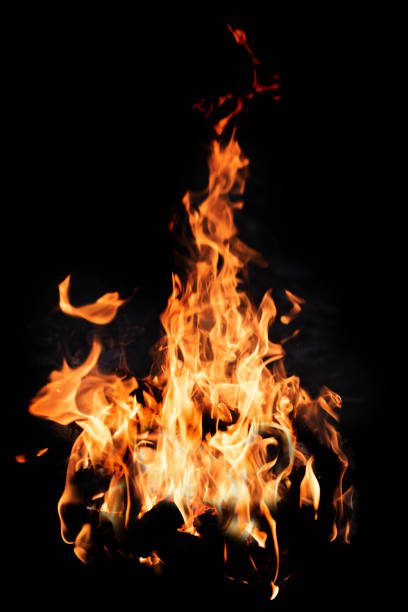 istock Bonfire flame isolated on black background, close up 1268518792